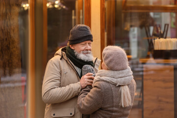 Obraz premium Happy mature couple outdoors on winter day