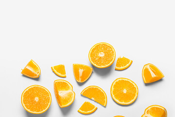 Tasty orange slices on white background