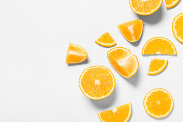 Tasty orange pieces on white background