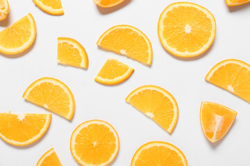 Fresh orange pieces on white background