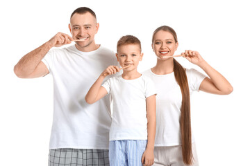Happy family brushing teeth on white background