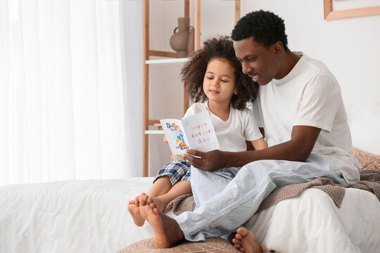 Cute African-American girl greeting her dad on Father's Day