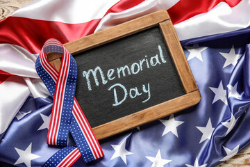 Fototapeta na wymiar Chalkboard with text MEMORIAL DAY, ribbon and USA flag