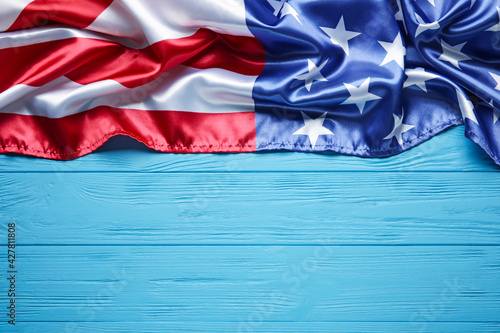 USA flag on color wooden background