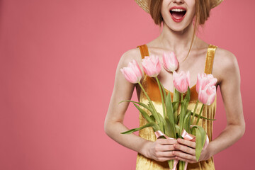 Woman with bouquet of flowers womens day 8 march pink background