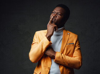 African descent businessperson dressed in yellow coat