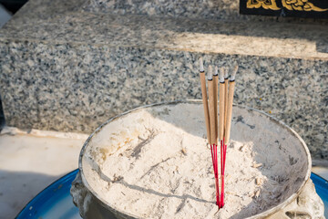 Incense sticks and ashes in incense burner close up.One of the factors causing PM2.5 dust problems in Thailand.