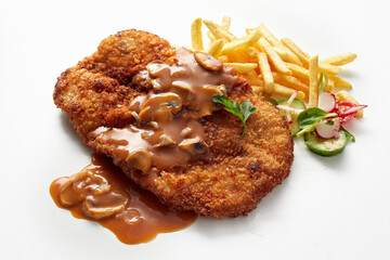 Fried breaded meat with mushroom sauce