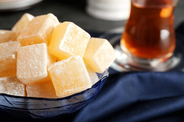 Bowl with Turkish delight on table, closeup