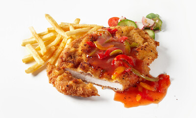 Fried meat schnitzel with sauce and French fries