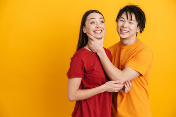 Happy multiethnic couple wearing t-shirts