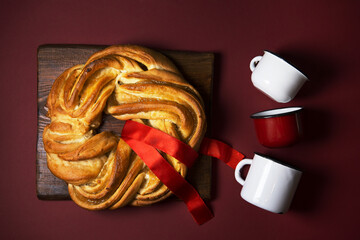 a pie on a red background is decorated with a red ribbon, a symbol of protest for freedom in...