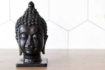 Statuette head of buddha, space for text