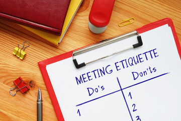  Financial concept meaning MEETING ETIQUETTE Do's and Don'ts with inscription on the sheet.