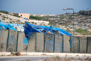 Broken boat of migrants beyond the border. Lampedusa, Italy. Summer 2009.