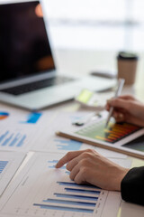 Financial Business woman analyze the graph of the company's performance to create profits and growth, Market research reports and income statistics, data,repotr,Financial and Accounting concept.