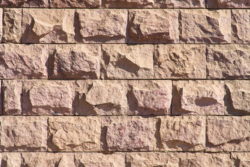 Simple stone wall. Masonry background with original pattern