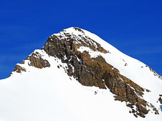 Snowy alpine mountain peak Oldenhorn (Oldehore or Becca d'Audon) located in a mountain massif Les...