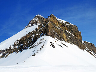 Snowy alpine mountain peak Oldenhorn (Oldehore or Becca d'Audon) located in a mountain massif Les...