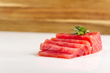 tuna sashimi. fresh raw yellowfin sliced tuna steak isolated on a white background. bluefin tuna medallions