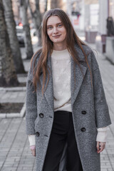 Portrait of an attractive girl on the street while walking