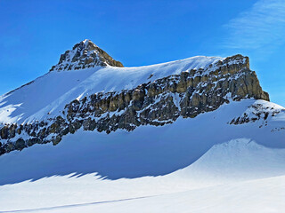 Snowy alpine mountain peak Oldenhorn (Oldehore or Becca d'Audon) located in a mountain massif Les...