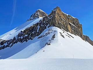 Snowy alpine mountain peak Oldenhorn (Oldehore or Becca d'Audon) located in a mountain massif Les...