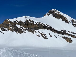 Snowy alpine mountain peak Oldenhorn (Oldehore or Becca d'Audon) located in a mountain massif Les...