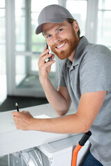 happy mover man on the phone