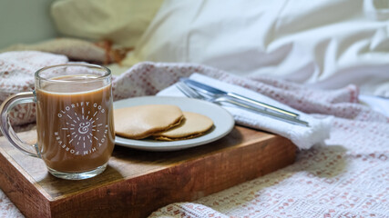 Breakfast in bed with coffee and pancake