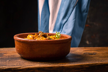 cazuela de locro traditional food and typical Argentine flag