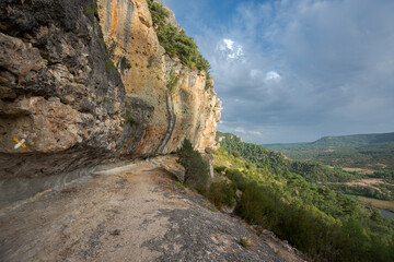Fototapeta na wymiar Pathway on the cliffs near the Uña lagoon, in the Serrania de Cuenca Natural Park, Spain