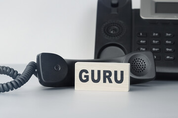 Closeup of the wooden block with text - GURU