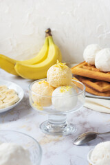 Traditional Belgian waffles with fruit ice-cream on gray plate. Banana taste. Sweet breakfest