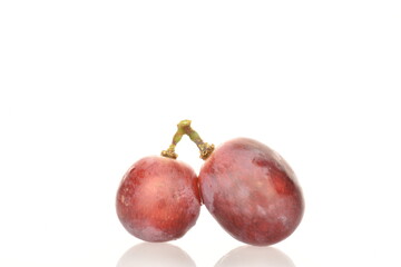 Three, fresh organic, juicy, ripe, sweet grapes, close-up, on a white background.