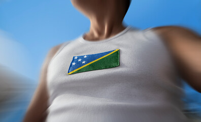 The national flag of Solomon Islands on the athlete's chest