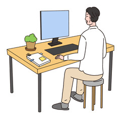 デスクでパソコン作業をしている男性