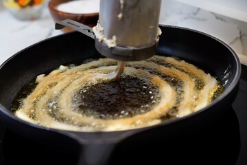 Cocinando churros en Madrid
