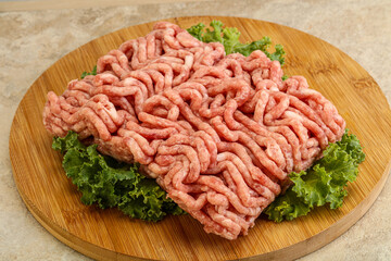 Raw pork minced meat over board