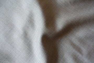 Elegant grey fabric with dupplins checks in soft folds