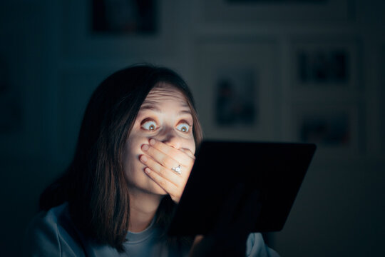 Shocked Woman Reading News on Pc Tablet