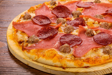 Pizza with ham and pepperoni