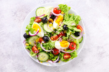 vegetable salad with egg,  cucumber and tomato
