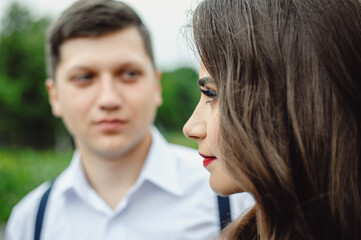 Fototapeta premium Loving happy couple, man and girl on valentine's day outdoors. Love and relationship between man and woman. Portrait of a couple in love 