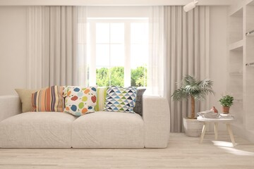 White living room with sofa and summer landscape in window. Scandinavian interior design. 3D illustration
