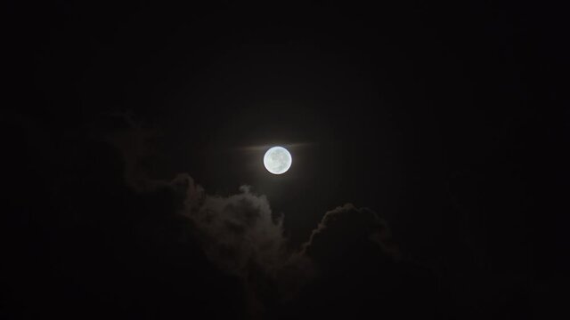 Beautiful full moon, behind the clouds. Brazil, fall.