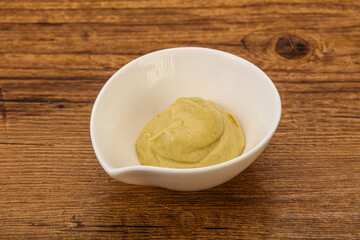Dijon mustard sauce in the bowl