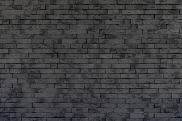 Fototapeta na wymiar 黒色のレンガ壁