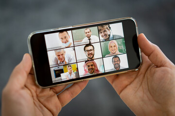 Online business conference screen in hands new normal