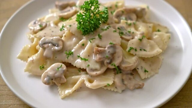 farfalle pasta with mushroom white cream sauce - Italian food style